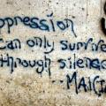 Graffiti that says oppression can only survive through silence